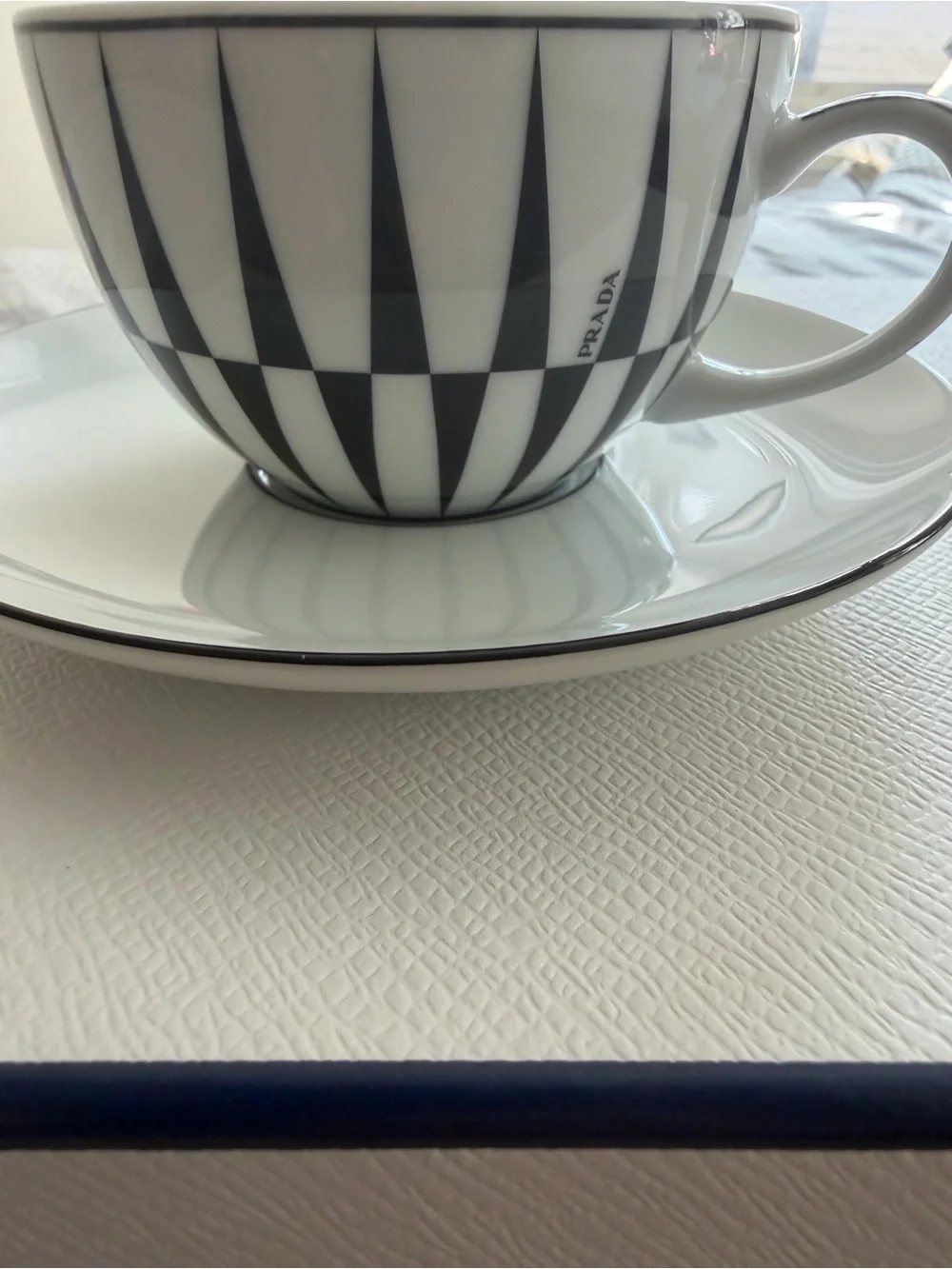 Prada White Porcelain Tea Cup & Saucer Set with Navy Accents
